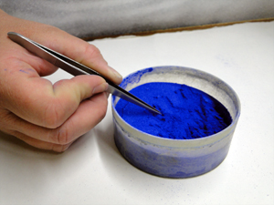Crushed colored glass powder applied by tweezers