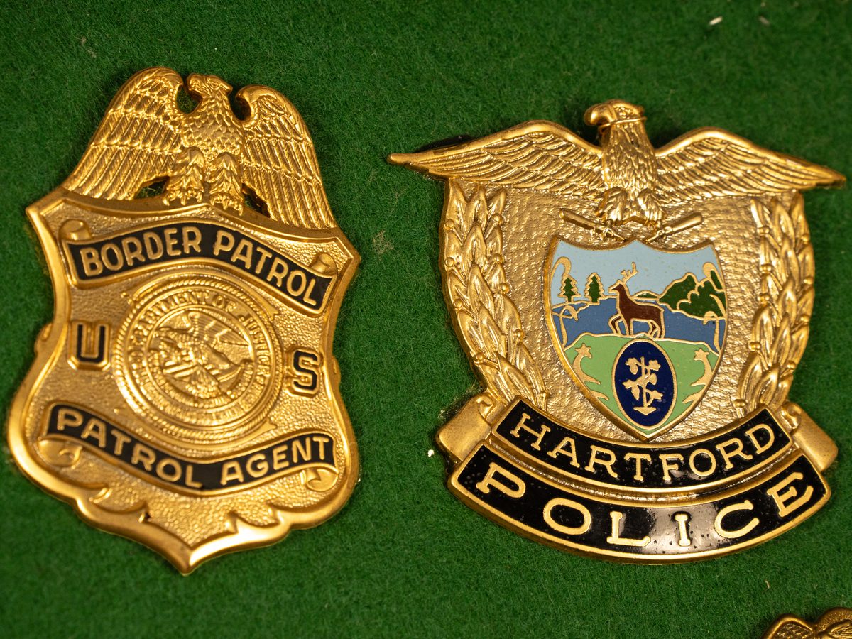 Border Patrol and Hartford Police badges with buffed epoxy color
