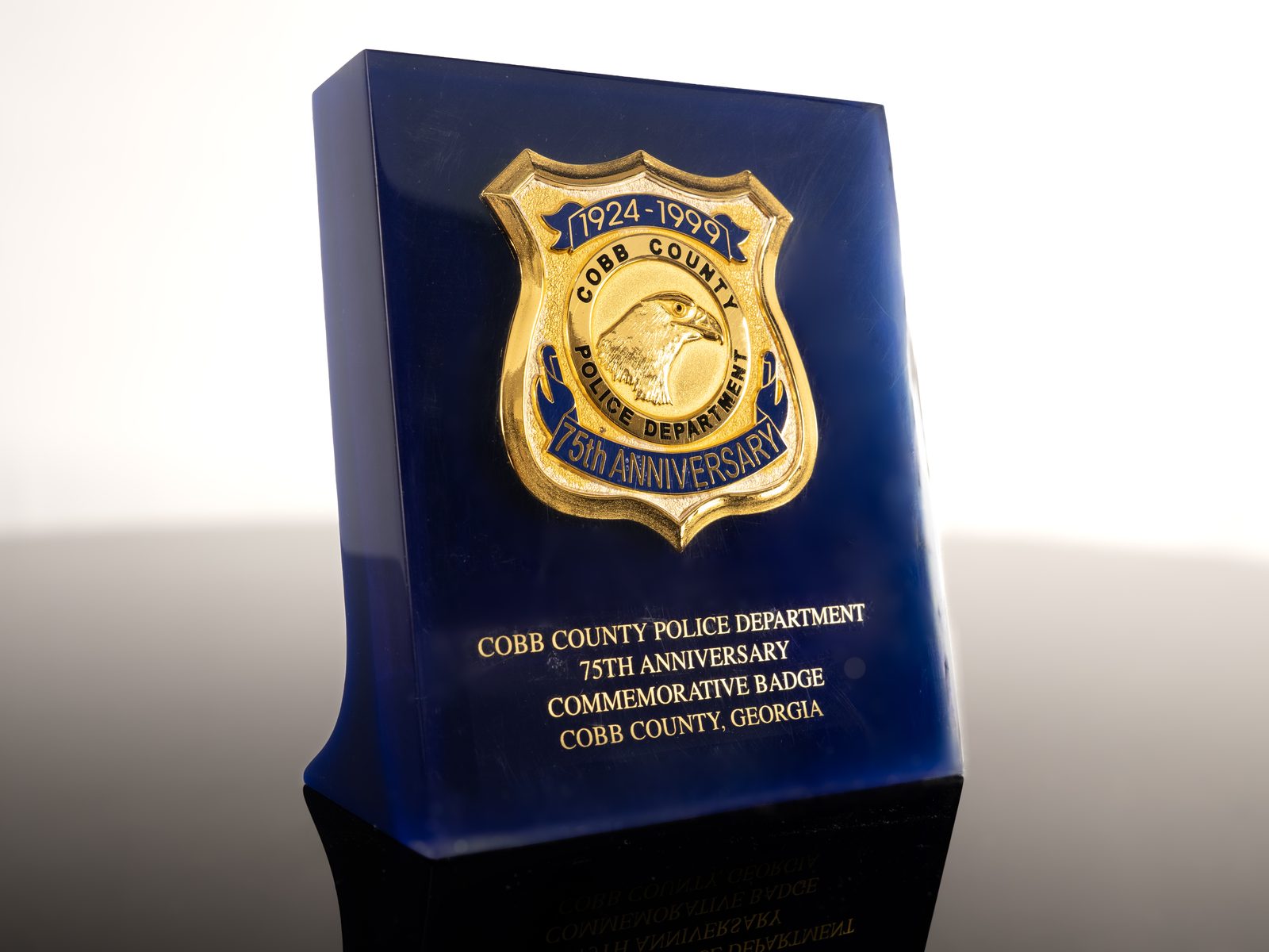 Cobb County Police 75th Anniversary commemorative badge in blue acrylic